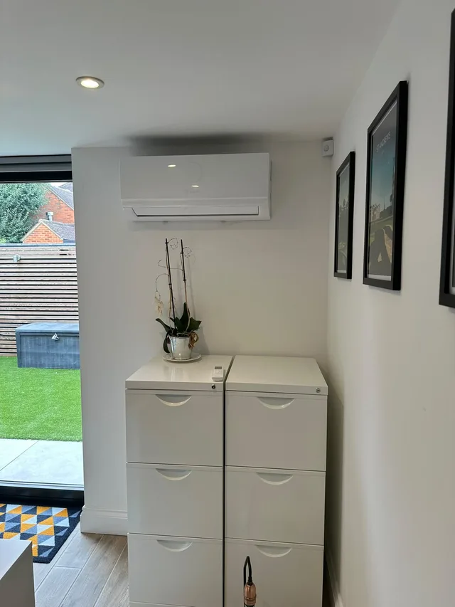 Wall-mounted air conditioning unit installed in a living room